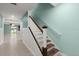 View of an open staircase, tiled floors, and modern paint at 3120 Areca Ave, New Smyrna Beach, FL 32168