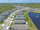 An aerial shot features homes in a lakeside community with a water fountain at 3128 Crab Trap Dr, New Smyrna Beach, FL 32168