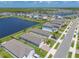 Aerial view of a community with water features and well-maintained homes at 3128 Crab Trap Dr, New Smyrna Beach, FL 32168