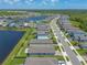 An aerial view captures a well-planned community with ponds and neatly arranged homes at 3128 Crab Trap Dr, New Smyrna Beach, FL 32168