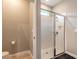 Bathroom featuring a glass enclosed shower, toilet, and linen closet at 3128 Crab Trap Dr, New Smyrna Beach, FL 32168