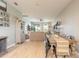 Open concept living area with modern decor, seamlessly connecting the dining and living spaces to the outdoor patio at 3128 Crab Trap Dr, New Smyrna Beach, FL 32168