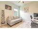 Cozy office with a comfortable sofa, modern desk setup, and ample natural light at 3128 Crab Trap Dr, New Smyrna Beach, FL 32168