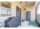 Enclosed patio featuring a ceiling fan, relaxing seating and lake views, great for grilling and relaxing at 3128 Crab Trap Dr, New Smyrna Beach, FL 32168