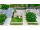 An aerial view of a well-maintained home with a manicured lawn and mature trees in a desirable neighborhood at 316 Oak Springs Dr, Debary, FL 32713