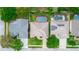 A birds-eye view showcasing the layout of properties, highlighting pool areas, landscaping, and roof details at 316 Oak Springs Dr, Debary, FL 32713