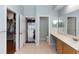 Large bathroom with dual sink vanity, open doors to toilet, and walk in closet at 316 Oak Springs Dr, Debary, FL 32713