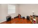 A workout bedroom features hardwood floors and a large window at 316 Oak Springs Dr, Debary, FL 32713