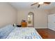 Neutral bedroom features hardwood floors and access to the en-suite bathroom at 316 Oak Springs Dr, Debary, FL 32713