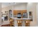 A kitchen features granite countertops, stainless steel appliances, and light brown cabinets at 316 Oak Springs Dr, Debary, FL 32713