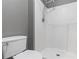 Bathroom featuring a walk-in shower and a toilet at 3267 Wild Pepper Ct, Deltona, FL 32725