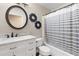 Bathroom featuring a vanity and a tub with a shower and a striped curtain at 3267 Wild Pepper Ct, Deltona, FL 32725