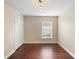 Bedroom featuring hardwood floors, and a closet with folding doors at 3267 Wild Pepper Ct, Deltona, FL 32725