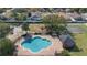 A community pool area featuring a pool, playground, and basketball court at 3267 Wild Pepper Ct, Deltona, FL 32725