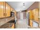 Well-lit kitchen with light wood cabinets, stainless steel appliances, and a neutral tile backsplash at 3267 Wild Pepper Ct, Deltona, FL 32725