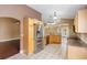 Bright kitchen with stainless steel appliances, granite countertops, and a view into the dining area at 3267 Wild Pepper Ct, Deltona, FL 32725