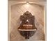Close-up shot of a unique lion head fountain with decorative tile in a cozy living area at 3267 Wild Pepper Ct, Deltona, FL 32725