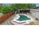 Aerial view of a backyard pool, showcasing the unique shape and surrounding patio area at 3267 Wild Pepper Ct, Deltona, FL 32725