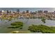 Aerial view showcases waterfront homes, docks, boats, and lush greenery along the coastline at 3799 S Atlantic Ave # 601, Daytona Beach, FL 32118
