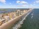 Breathtaking aerial view of a coastline featuring condos, a sandy beach, and oceanfront living at 3799 S Atlantic Ave # 601, Daytona Beach, FL 32118