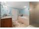 Bright bathroom boasts a soaking tub, walk-in shower, and ample counter space at 3799 S Atlantic Ave # 601, Daytona Beach, FL 32118