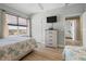 Light bedroom features water views, seaside decor and TV at 3799 S Atlantic Ave # 601, Daytona Beach, FL 32118