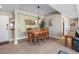 Cozy dining area featuring a stylish chandelier and comfortable seating for six guests at 3799 S Atlantic Ave # 601, Daytona Beach, FL 32118