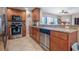 Well-appointed kitchen with stainless steel appliances, granite countertops, and ample cabinet space at 3799 S Atlantic Ave # 601, Daytona Beach, FL 32118
