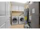 Functional laundry room features washer, dryer, and storage space at 3799 S Atlantic Ave # 601, Daytona Beach, FL 32118