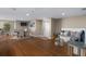 Well-lit lobby featuring wood floors, a dining table, sitting area with pillows, and a TV for residents and guests at 3799 S Atlantic Ave # 601, Daytona Beach, FL 32118