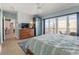This spacious main bedroom features balcony access and a hallway to other rooms at 3799 S Atlantic Ave # 601, Daytona Beach, FL 32118