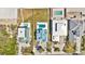 Aerial view of houses, pools, and driveways near the beach, offering a glimpse of coastal community living at 4363 S Atlantic Ave, Ponce Inlet, FL 32127