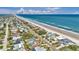 Extensive aerial shot of coastal real estate showcasing oceanfront properties, beach, and city views at 4363 S Atlantic Ave, Ponce Inlet, FL 32127