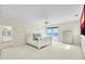 Bright bedroom featuring ocean views, access to a balcony and comfortable bedding at 4363 S Atlantic Ave, Ponce Inlet, FL 32127