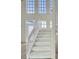 Bright staircase with multiple windows allowing natural light to illuminate the entry at 4363 S Atlantic Ave, Ponce Inlet, FL 32127