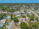 An aerial view showcases homes in a well-established community with mature trees and tranquil ponds at 4589 Alder Dr, Port Orange, FL 32127