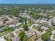 An aerial shot with a pond view showcasing homes in a vibrant community with tree-lined streets at 4589 Alder Dr, Port Orange, FL 32127