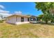 Beautiful backyard featuring a well-maintained lawn and mature trees at 4589 Alder Dr, Port Orange, FL 32127
