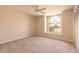 Serene bedroom with neutral carpet, large arched window, and a spacious closet at 4589 Alder Dr, Port Orange, FL 32127
