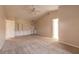 Spacious bedroom featuring built-in shelving, vaulted ceilings, and a ceiling fan at 4589 Alder Dr, Port Orange, FL 32127