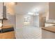 Bright kitchen featuring a window with a view, neutral walls and light colored appliances at 4589 Alder Dr, Port Orange, FL 32127