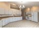 Bright eat in kitchen with a modern refrigerator, microwave and lots of cabinets at 4589 Alder Dr, Port Orange, FL 32127