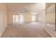Spacious living room with sliding glass doors and large windows at 4589 Alder Dr, Port Orange, FL 32127