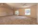 Bright living room with sliding glass doors and a large window offering lots of natural light at 4589 Alder Dr, Port Orange, FL 32127