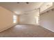 Living room featuring neutral carpeting, a ceiling fan, and an adjacent hall at 4589 Alder Dr, Port Orange, FL 32127