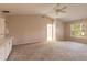 Spacious main bedroom with natural light, carpet, and a built-in desk area at 4589 Alder Dr, Port Orange, FL 32127