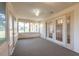 Cozy carpeted sunroom with plenty of windows for natural light at 4589 Alder Dr, Port Orange, FL 32127
