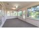 Bright and airy sunroom surrounded by windows at 4589 Alder Dr, Port Orange, FL 32127
