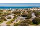 Aerial view of coastal home featuring a backyard pool and proximity to the beach at 4745 Dixie Dr, Ponce Inlet, FL 32127