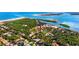 Beautiful aerial view showcases the lighthouse, the ocean, and the boat docks at 4745 Dixie Dr, Ponce Inlet, FL 32127